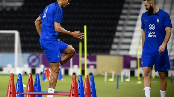 France’s Raphael Varane, left, and Karim Benzema train at the Al Sadd Stadium in Doha on November 17: AFP/Franck Fife