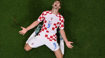 Croatia's forwardAndrej Kramaric celebrates scoring his team's first goal during the Qatar 2022 World Cup Group F match against Canada at the Khalifa International Stadium in Doha on November 27, 2022. (Photo by Antonin THUILLIER / AFP)