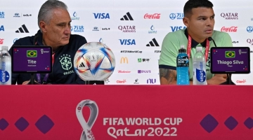 Brazil's coach Tite (left) and defender Thiago Silva attend a press conference at the Qatar National Convention Center (QNCC) in Doha on November 23, 2022. (Photo by NELSON ALMEIDA / AFP)