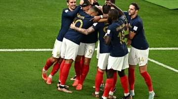 France players celebrate after scoring their fourth goal against Australia at the Al Janoub Stadium on November 22: AFP/Anne-Christine Poujoulat