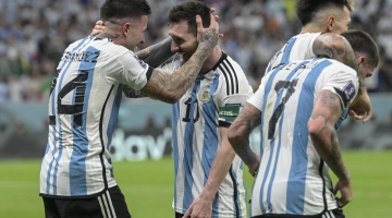 Argentina’s Enzo Fernandez celebrates with Lionel Messi after scoring their second goal against Mexico: AFP/Juan Mabromata
