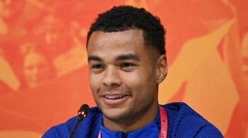 Netherland's forward Cody Gakpo attends a press conference at the Qatar University training site, in Doha, on November 27, 2022. (Photo by Alberto PIZZOLI / AFP)