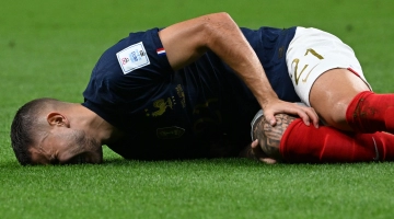 Lucas Hernandez reacts after he sustained an injury during the match against Australia: AFP/Chandan Khanna