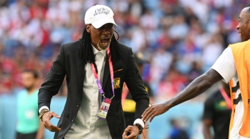Cameroon's coach Rigobert Songreacts after his team scored the first goal during the Qatar 2022 World Cup Group G match against Serbia at the Al-Janoub Stadium in Al-Wakrah on November 28, 2022. (Photo by Issouf SANOGO / AFP)