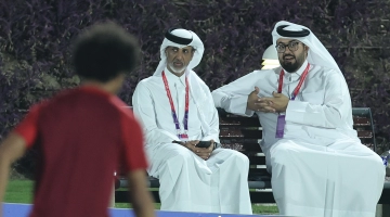 Qatar Football Association President HE Sheikh Hamad bin Khalifa bin Ahmed Al Thani, left, and Qatar national team manager Talal Al Kaabi attend a training session in Doha on November 16: AFP/Karim Jaafar