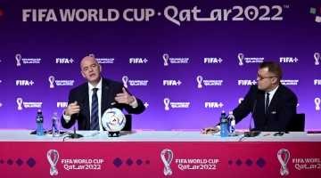 FIFA President Gianni Infantino, left, and FIFA’s Director of Media Relations Bryan Swanson address a Press conference at the Qatar National Convention Center in Doha on November 19: AFP/Fabrice Coffrini
