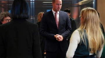 Britain's Prince William (C) meets with members of the Welsh Youth Parliament during a visit to the Senedd, the Welsh Parliament, in Cardiff on November 16, 2022. (Photo by Geoff Caddick / POOL / AFP)
