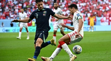 Australia’s Mathew Leckie, left, and Tunisia’s Yousef Msakni battle for possession: AFP/Anne-Christine Poujoulat