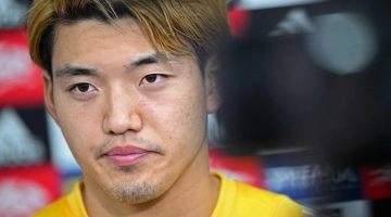 Japan's midfielder Ritsu Doan gives a press conference at the Al Sadd SC training grounds in Doha on November 19, 2022, ahead of the Qatar 2022 World Cup football tournament. (Photo by Philip FONG / AFP)