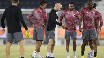 Felix Sanchez, centre, leads a training session of the Qatar national team in Doha. AFP/Karim Jaafar