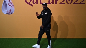 Senegal's coach Aliou Cisse arrives to give a press conference at the Qatar National Convention Center (QNCC) in Doha on November 28, 2022. (Photo by OZAN KOSE / AFP)
