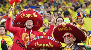 Mexican supporters cheer ahead of the Qatar 2022 World Cup Group A football match between Qatar and Ecuador at the Al-Bayt Stadium in Al Khor, north of Doha on November 20, 2022. (Photo by Glyn KIRK /AFP)