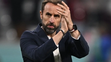 England's coach Gareth Southgate applauds at the end of the Qatar 2022 World Cup Group B football match between England and Iran at the Khalifa International Stadium in Doha on November 21, 2022. (Photo by Paul ELLIS / AFP)