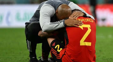 Belgium's assistant coach Thierry Henry hugs defender Toby Alderweireld after the Qatar 2022 World Cup Group F match against Croatia at the Ahmad Bin Ali Stadium in Al-Rayyan on December 1, 2022. (Photo by OZAN KOSE / AFP