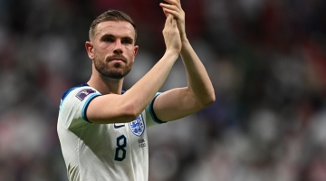 England's Jordan Henderson celebrates after qualifying to the next round by defeating Senegal 3-0 in the Qatar 2022 World Cup round of 16 match at the Al-Bayt Stadium in Al Khor on December 4, 2022. (Photo by Paul ELLIS / AFP)