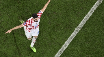 Croatia's Josko Gvardiol celebrates his team's win after penalty shoot-outs in the Qatar 2022 World Cup round of 16 match against Japan at the Al-Janoub Stadium in Al-Wakrah on December 5, 2022. (Photo by François-Xavier MARIT / AFP)