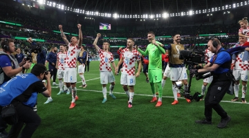Croatian players celebrate their victory over Brazil: AFP/Jack Guez