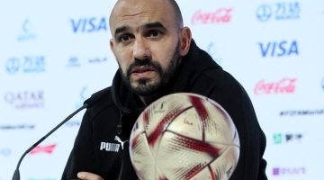 Morocco's coach Walid Regragui speaks during a press conference in Doha on December 13, 2022. (Photo by KARIM JAAFAR / AFP)
