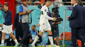Portugal's Cristiano Ronaldo reacts after losing the Qatar 2022 World Cup quarter-final  match between Morocco and Portugal at the Al-Thumama Stadium in Doha on December 10, 2022. (Photo by Odd ANDERSEN / AFP)