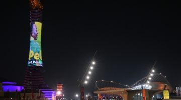 The Torch tower of Doha lit by a screen depicting Brazilian star Pele and reading a message in support to the former Brazilian football player in Doha on December 3, 2022. (Photo by NELSON ALMEIDA / AFP)