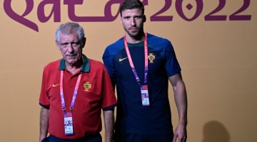 Portugal's coach Fernando Santos (left) and Ruben Dias arrive for a press conference at the Qatar National Convention Center (QNCC) in Doha on December 5, 2022. (Photo by PATRICIA DE MELO MOREIRA / AFP)