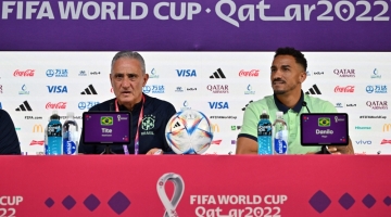 Brazil's coach Tite (left) and defender Danilo give a press conference at the Qatar National Convention Center (QNCC) in Doha on December 8, 2022. (Photo by NELSON ALMEIDA / AFP)