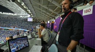 Bryan Kelly running an audio descriptive commentary for blind and partially-sighted fans during one of the matches of Qatar 2022.