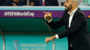 Morocco's coach Walid Regragui gestures during the Qatar 2022 World Cup quarter-final match against Portugal at the Al-Thumama Stadium in Doha on December 10, 2022. (Photo by Odd ANDERSEN / AFP)