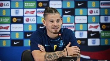 England's midfielder Kalvin Phillips smiles during a press conference at the Al Wakrah Stadium in Al Wakrah, Qatar, on December 8, 2022. (Photo by Paul ELLIS / AFP)