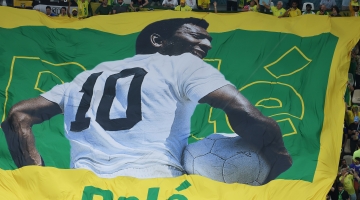 A large flag of Brazil legend Pele is unveiled in the crowd ahead of their group match against Cameroon at the Lusail Stadium on December 2, 2022: AFP/Giuseppe Cacace