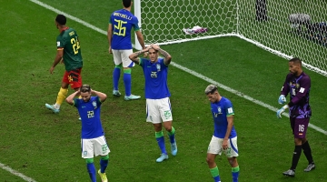 Brazil players react after Cameroon scored against them: AFP/Anne-Christine Poujoulat