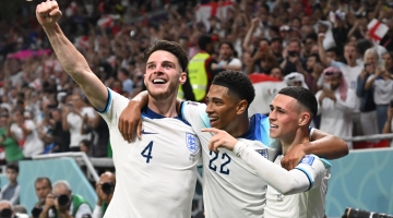 England’s Declan Rice, left, and team-mates Jude Bellingham, centre, and Phil Foden celebrate a goal against Wales: AFP/Ina Fassbender