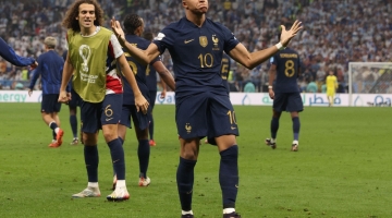 France's forward Kylian Mbappe celebrates scoring his team's second goal during the Qatar 2022 World Cup final match against Argentina at Lusail Stadium in Lusail on December 18, 2022. (Photo by Adrian DENNIS / AFP)