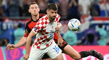 Belgium’s Jan Vertonghen, left, fights for the ball with Croatia’s Bruno Petkovic: AFP/Chandan Khanna