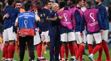 France's coach Didier Deschamps congratulates his players after the Qatar 2022 World Cup semi-final match against Morocco at the Al-Bayt Stadium in Al Khor, north of Doha on December 14, 2022. (Photo by Kirill KUDRYAVTSEV / AFP)