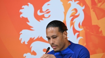Netherlands' defender Virgil van Dijk gives a press conference at the Qatar University Training Site 6 in Doha on December 7, 2022. (Photo by Alberto PIZZOLI / AFP)