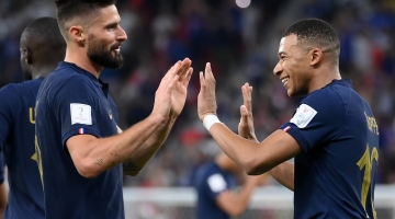 France’s Kylian Mbappe, right, celebrates scoring their second goal with team-mate Olivier Giroud against Poland: AFP/Franck Fife