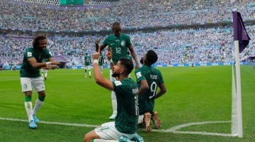 Saudi Arabian players celebrate a goal against Argentina: AFP/Odd Andersen