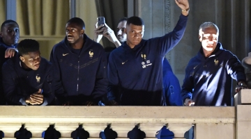 France players and coach Didier Deschamps greet supporters at the Hotel de Crillon, Place de la Concorde, in central Paris: AFP/Julien De Rosa
