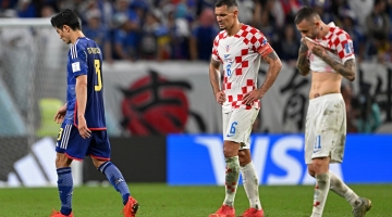 Croatia's defender Dejan Lovren reacts at the end of extra time during the Qatar 2022 World Cup round of 16 match against Japan at the Al-Janoub Stadium in Al-Wakrah on December 5, 2022. (Photo by OZAN KOSE / AFP)
