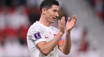 Poland captain Robert Lewandowski greets fans after their 1-3 loss to France in the Round of 16: AFP/Kirill Kudryavtsev
