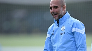 In this file photo taken on September 5, 2022 Manchester City's manager Pep Guardiola leads a training session at the Manchester City training ground in Manchester.  (Photo by OLI SCARFF / AFP)