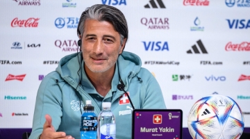 Switzerland's coach Murat Yakin attends a press conference in Doha on December 5, 2022, on the eve of the Qatar 2022 World Cup Round of 16 match against Portugal. (Photo by Fabrice COFFRINI / AFP)