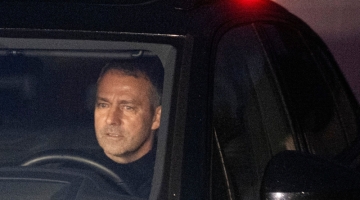 German head coach Hans-Dieter 'Hansi' Flick in his car leaves the Kempinski Hotel in Frankfurt am Main on December 7, 2022, after talks with DFB officials. (Photo by Boris Roessler / dpa / AFP) / Germany OUT