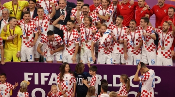 Croatia's players celebrate after winning the Qatar 2022 World Cup football third place play-off match at Khalifa International Stadium in Doha on December 17, 2022. (Photo by ADRIAN DENNIS / AFP)