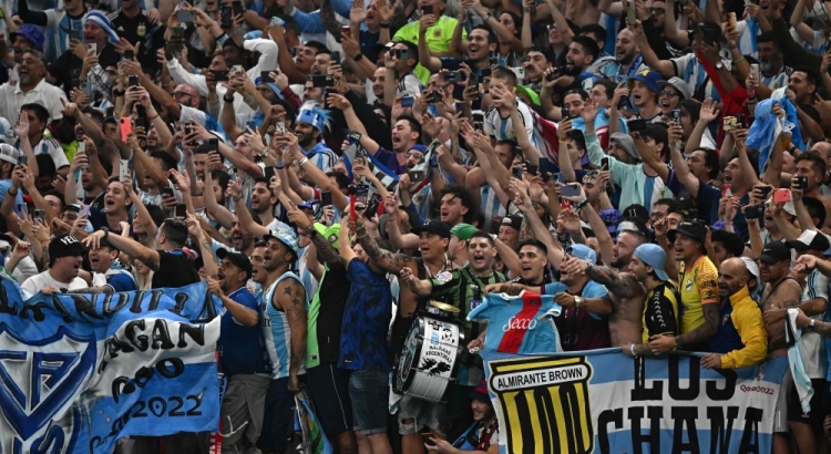 Argentina supporters celebrate after their team won the Qatar 2022 World Cup football semi-final match between Argentina and Croatia at Lusail Stadium in Lusail, north of Doha on December 13, 2022. (Photo by Anne-Christine POUJOULAT / AFP)