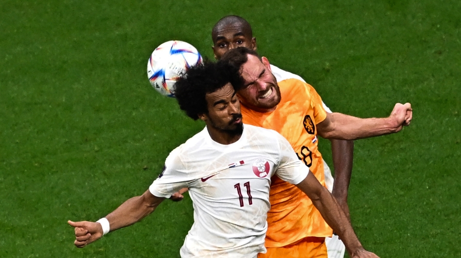 Qatar’s Akram Afif heads the ball against the Netherlands: AFP/Anne-Christine Poujoulat