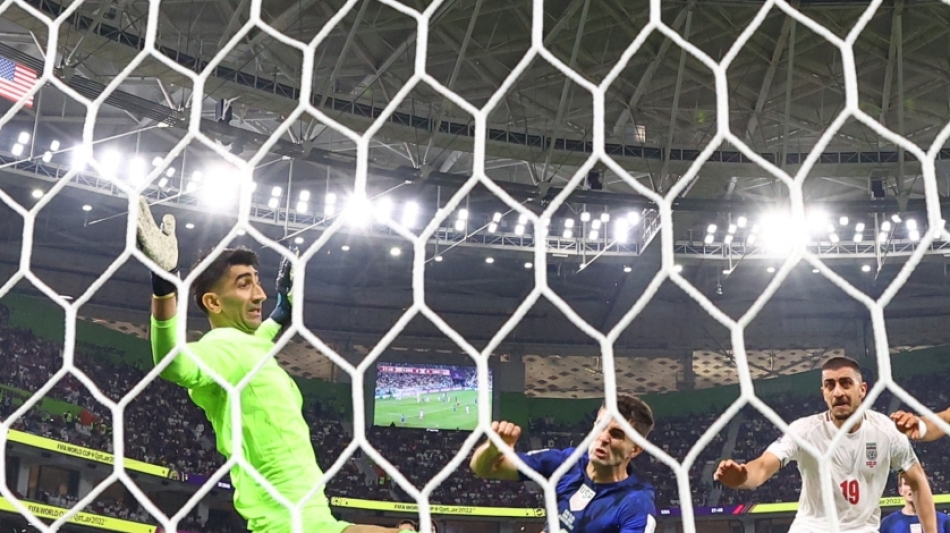 Christian Pulisic of the US scores the only goal of the FIFA World Cup Group B match past Iran's Alireza Beiranvand at the Al Thumama Stadium, Doha, Qatar, on  November 29, 2022. REUTERS/Kai Pfaffenbach