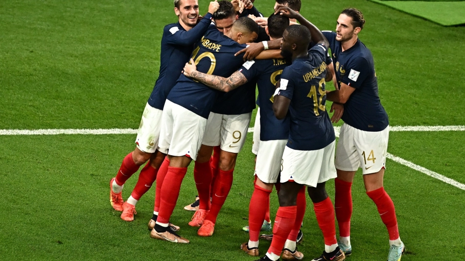 France players celebrate after scoring their fourth goal against Australia at the Al Janoub Stadium on November 22: AFP/Anne-Christine Poujoulat