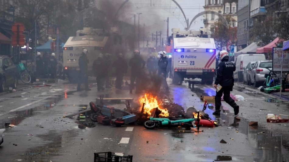 Riot police clear the street after a riot on thesideline of theQatar 2022 World Cup Group F match between Belgium and Morocco, in Brussels, on November 27, 2022. (Photo by NICOLAS MAETERLINCK / BELGA / AFP)